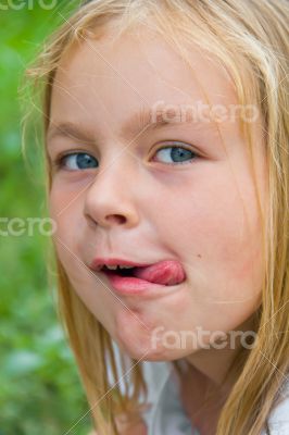 Cute girl with put out tongue