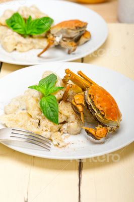 Italian gnocchi with seafood sauce with crab and basil