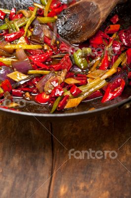 fried chili pepper and vegetable on a wok pan