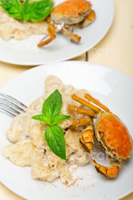 Italian gnocchi with seafood sauce with crab and basil