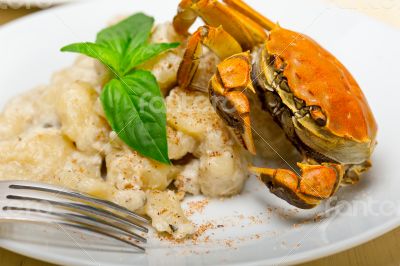 Italian gnocchi with seafood sauce with crab and basil