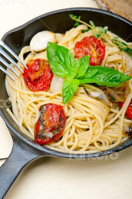 spaghetti pasta with baked cherry tomatoes and basil 