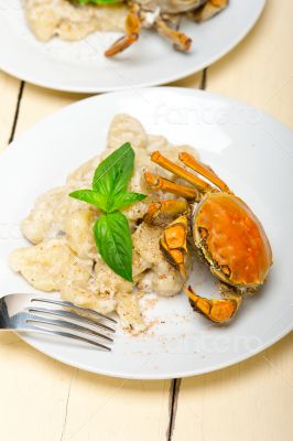 Italian gnocchi with seafood sauce with crab and basil