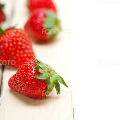 fresh organic strawberry over white wood fresh organic strawberry over white wood