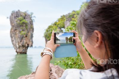 Women tourist shooting view by mobile phone