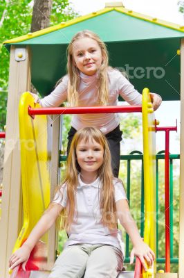 Two active girls on nursery platform