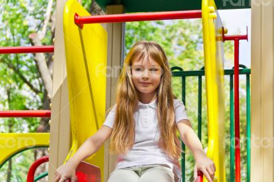 Active girl on nursery platform in summer