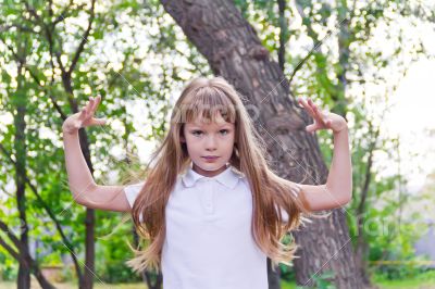 Cute girl playing with long hair