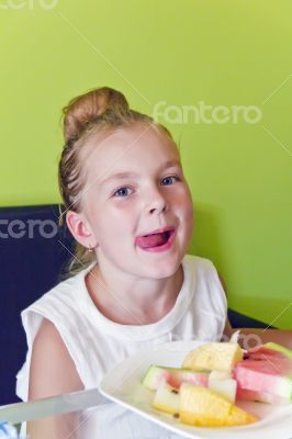 Eating girl with put out tongue