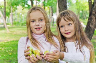 Cute girls with apples