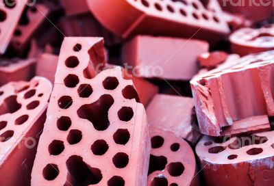 Pile of new but beaten silicate bricks