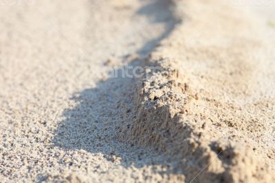 Sand surface with the relief formed by water 