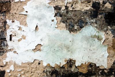 The wall texture with the damaged plaster 
