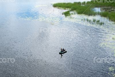 Two fishermen in the rubber boat
