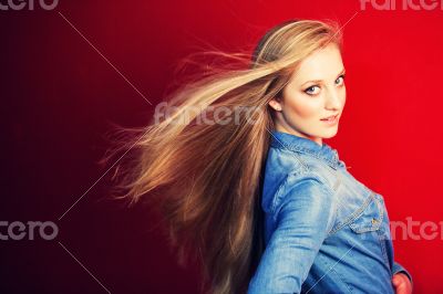 Young model against red wall Young model against red wall