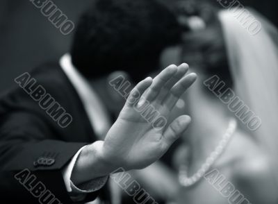 Hands of the groom