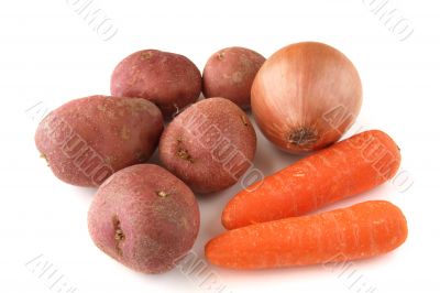  carrots, potatoes and onion on white background