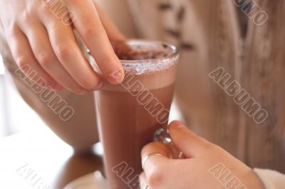 Hot chocolate in girl hands