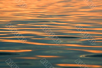 Background. Solar sparks on water.