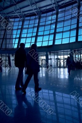 People silhouettes at airport building