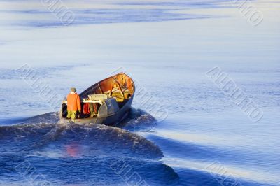 Fisherman floating old boat