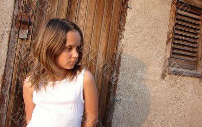 The girl in beams of the coming sun