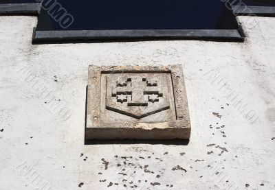  arms on a building of a chapel