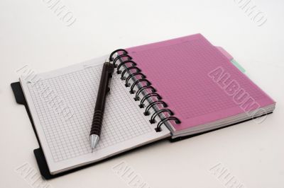 Notebook with a pencil on a white background