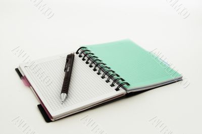Notebook with a pencil on a white background