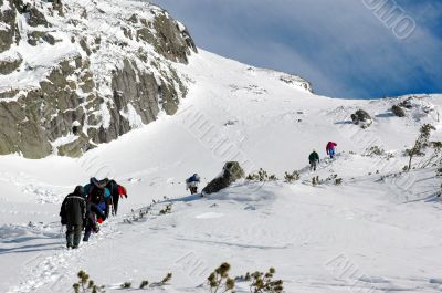 A team climbing a high mountain