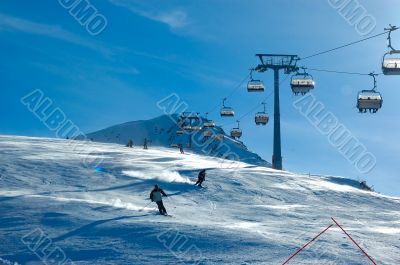 skiers on chair lift