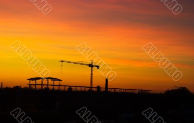 Tower crane in sunset