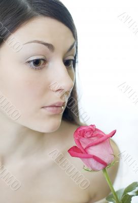 Female smells a rose