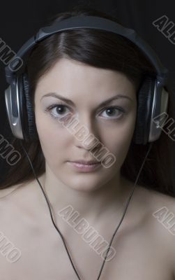 pretty girl in headphones listens to music