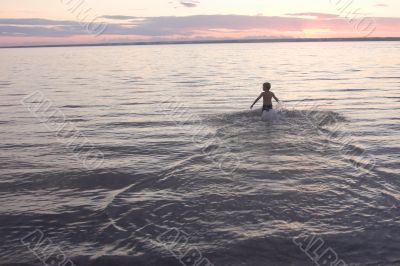 boy on the evening beach