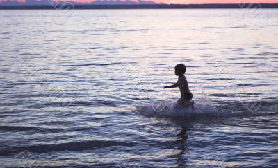 boy on rhe sea sunset