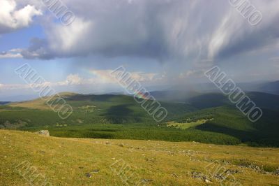 mountain landscape with rainbow