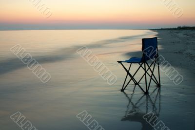 Folding chair on a seaside
