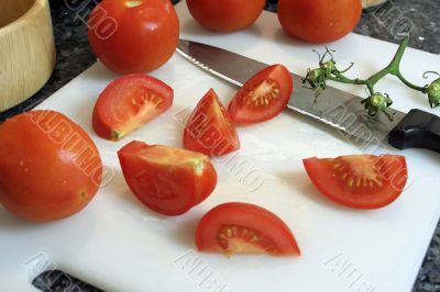 Slicing tomatoes into wedges for a salad