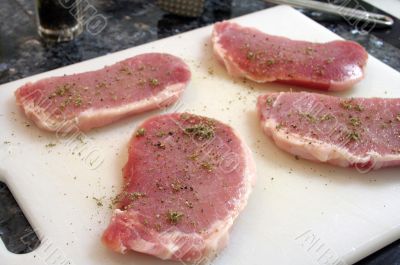 Four seasoned pork loin chops