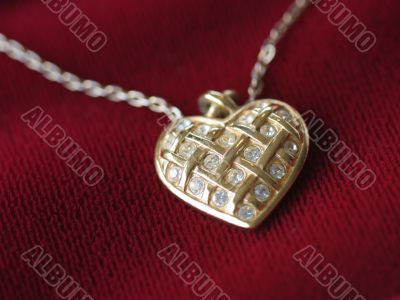 Heart necklace on red