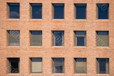 Office windows in the brick wall
