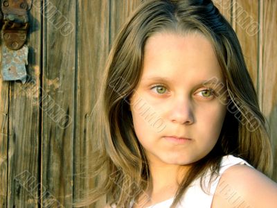 The girl in beams of the coming sun