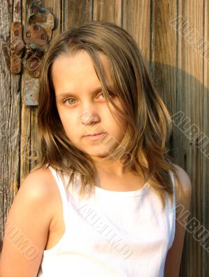 The girl in beams of the coming sun