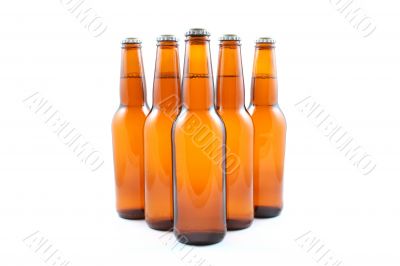 five dark bottles of beer
