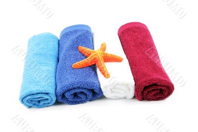 Colorful towels and orange starfish