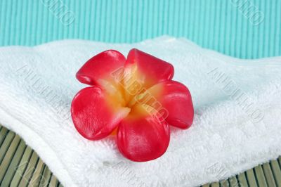 Candle on a white towel - spa products