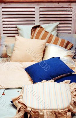 Bed with lots of pillows