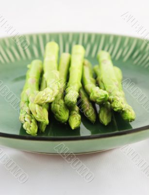 Fresh asparagus shoots on a plate