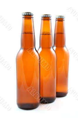 three bottles of beer isolated on white